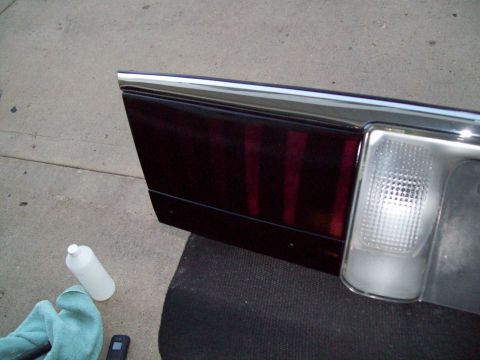 1999 Mercury Grand Marquis - A car's tail light assembly is shown, possibly being cleaned or prepped for installation.