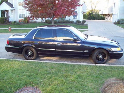 1999 Mercury Grand Marquis - This 1999 Mercury Grand Marquis is seen from the side, parked along a residential street.