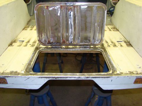 1948 Jeep Wrangler - The rear section of a vehicle body is shown with an open access panel, revealing the interior.
