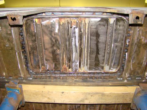 1948 Jeep Wrangler - Welded metal panel on a vehicle's underbody, showing signs of rust and repair.