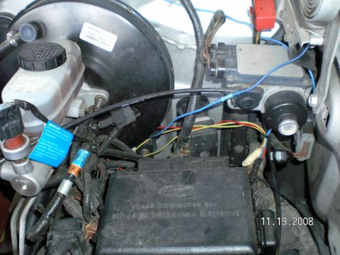 1996 Ford Bronco - Connector is on drivers side inner fender. You can just see it next to the red, yellow, and blue wires with the masking tape. It is the sma…