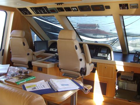 1976 Ford F-150 - The interior of a yacht's bridge shows a command center with seating and navigation equipment.
