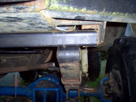 1986 Ford Bronco - Got a couple of sticks of 2X4 3/16" thick. Cut one just long enough to fit between the framerails. Notched the end to slide it in. (Driver'…