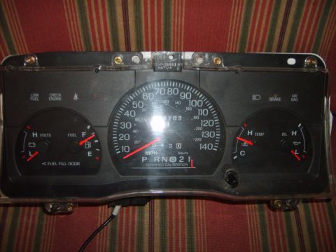 1993 Ford Crown Victoria - Instrument cluster from a vehicle, gauges for speed, fuel, temperature, and oil.