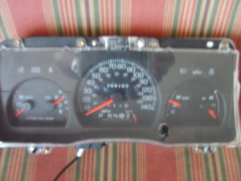 Instrument cluster with speedometer, fuel gauge, and temperature gauge