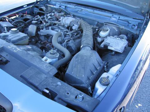 2001 Ford Crown Victoria - Engine bay of a 2001 Ford Crown Victoria, showing the V8 engine and associated components.