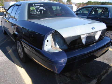 2001 Ford Crown Victoria - This 2001 Ford Crown Victoria is missing its driver's side taillight assembly and appears to be stripped down.