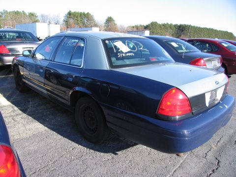2001 Ford Crown Victoria - Rear view of a Ford Crown Victoria with handwritten notes on the back window.