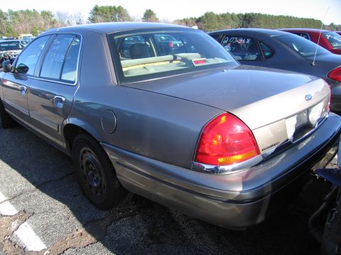 2001 Ford Crown Victoria - Rear view of a 2001 Ford Crown Victoria, showing its taillight and trunk area.