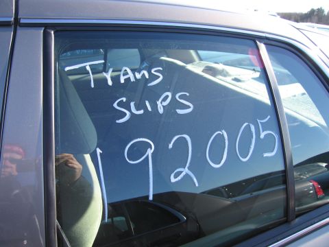 2001 Ford Crown Victoria - White text on a car window reads 'TRANS SLIPS 192005'.