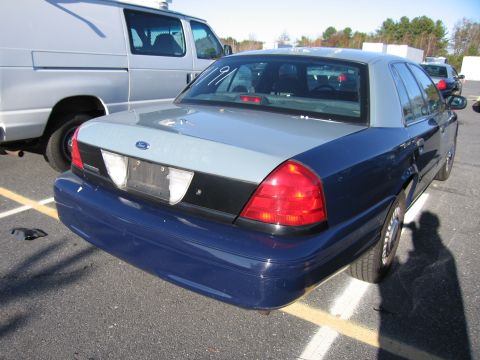 2001 Ford Crown Victoria - Rear view of a two-tone blue and grey 2001 Ford Crown Victoria.