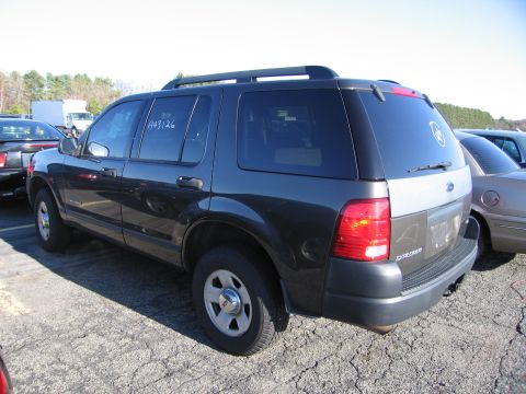 2001 Ford Crown Victoria - A dark gray Ford Explorer SUV is parked outdoors, showing its rear and side profile.