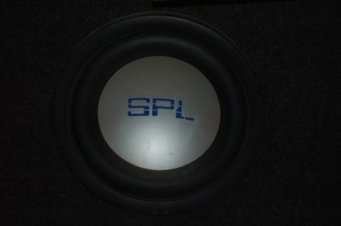 1991 Ford Probe - Close-up of a car audio subwoofer with the SPL logo visible on the cone.