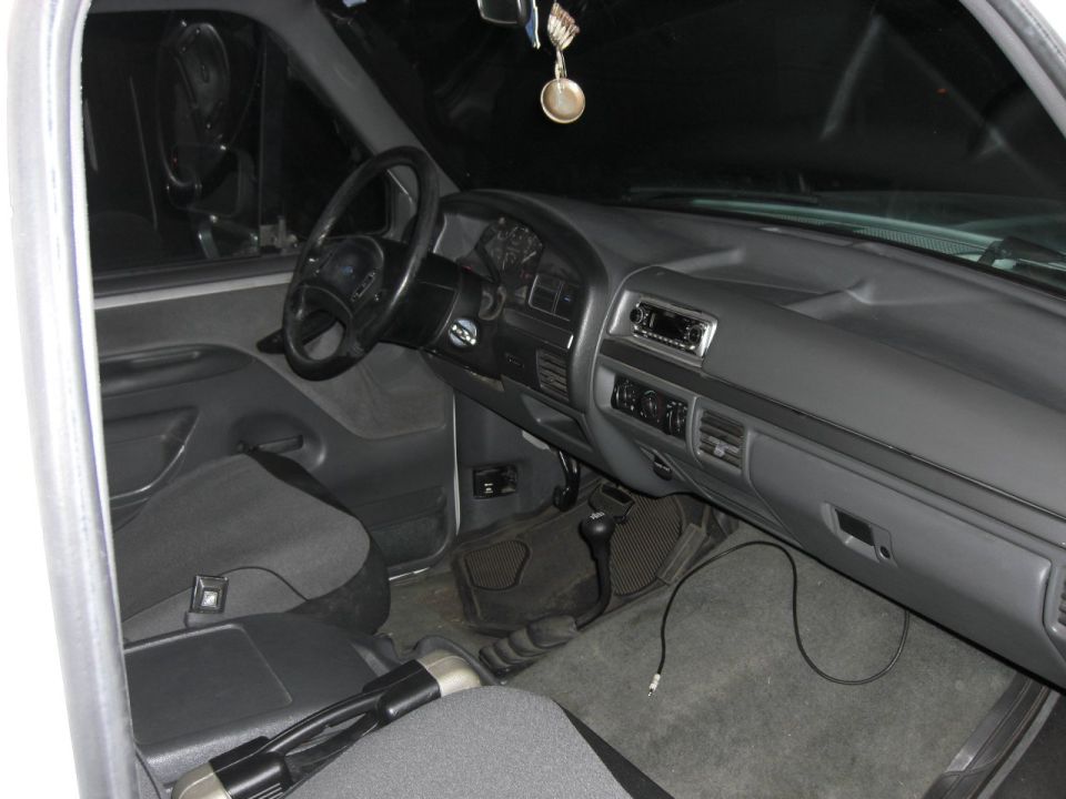 Interior view of a 1992 Ford F-Series truck dashboard and seats
