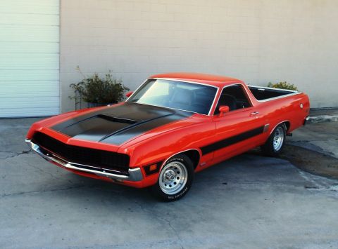 1970 Ford Ranchero - This 1970 Ford Ranchero GT features a distinctive black hood scoop and side stripe, presented in a three-quarter front view.