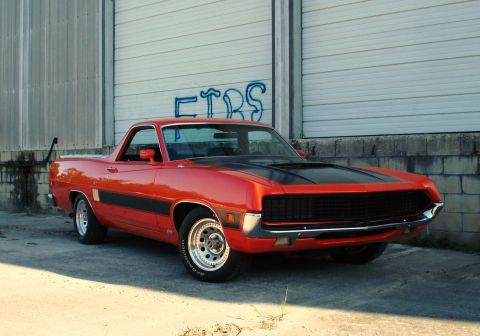 1970 Ford Ranchero - This 1970 Ford Ranchero GT features a distinctive two-tone paint scheme with a black hood stripe and side accent.