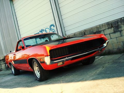 1970 Ford Ranchero - This 1970 Ford Ranchero features a distinctive grille and a two-tone paint scheme.
