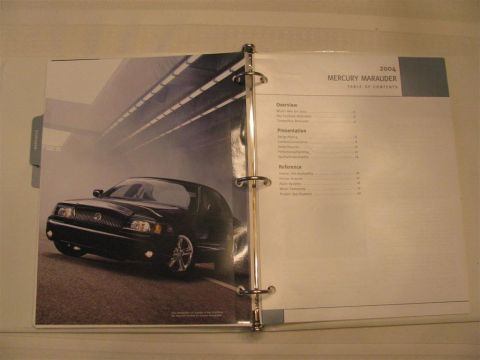 2003 Mercury Marauder - A brochure for the 2004 Mercury Marauder is open to a page showing the car and its table of contents.