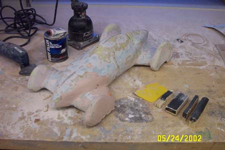 1966 Ford Five Hundred - Fiberglass resin and Bondo are then mixed together and applied liberally over the model. Once a thick coat is achieved, it can be sanded sm…
