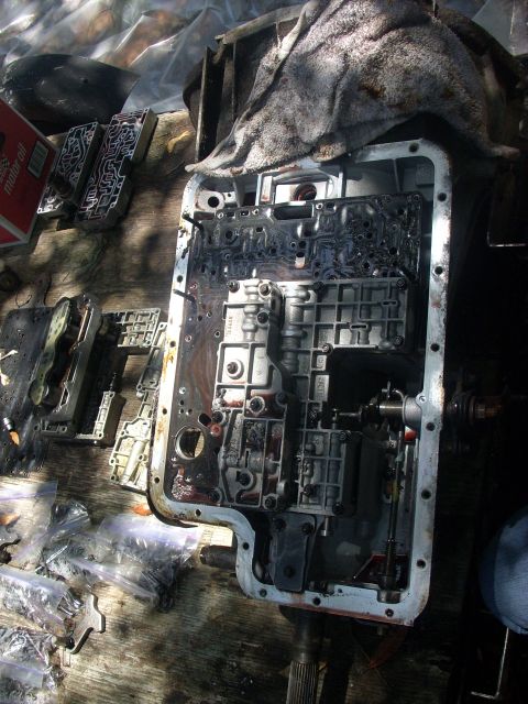 1992 Ford Bronco - next is the main valve body, followed by the 3 bolts retaining the seperator plate