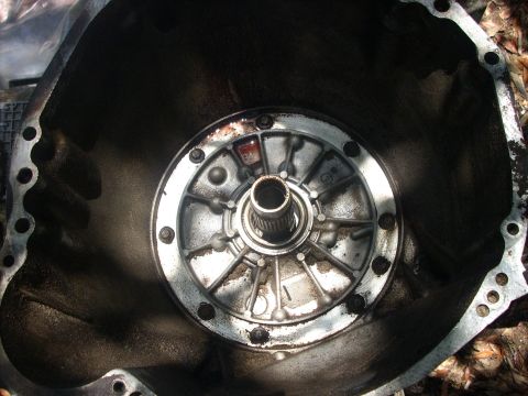 1992 Ford Bronco - next remove the nine 10mm bolts holding the pump in.....you may have to shake the front pump to get it out....be carefull not to lose the t…
