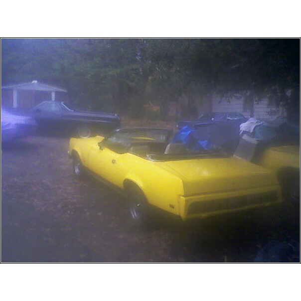 1973 Mercury Cougar convertible parked outdoors, another car in background