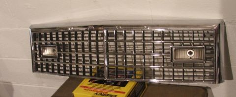 1989 Ford Bronco II - Chrome grille with integrated rectangular headlights, likely for an older vehicle.