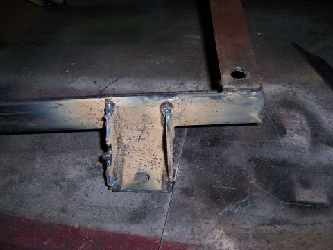 1991 Ford Bronco - A close-up view of a metal seat bracket, highlighting its construction and condition.