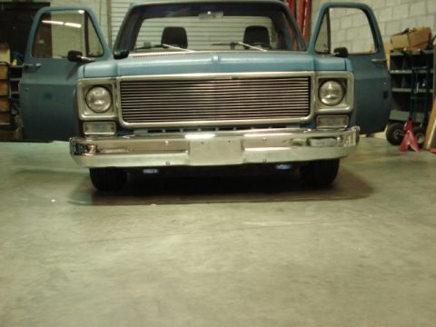 1979 Chevrolet C/K Pickup - The horizontal grille and headlight design suggest this pickup truck is from the mid-to-late 1970s, likely around 1977.