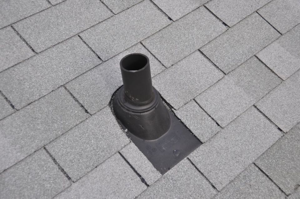 Roof vent pipe on gray shingles