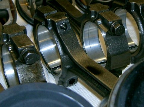 2007 Ford Mustang - Engine connecting rods are shown in this close-up view, highlighting their mechanical components.