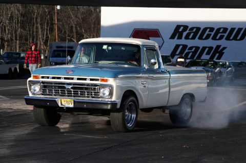 2007 Ford Mustang - A classic Ford F-Series truck performs a burnout at Raceway Park.