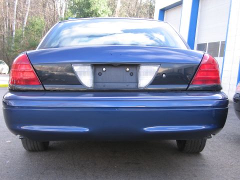 1991 Ford LTD Crown Victoria - Rear view of a blue sedan, showing its taillights and license plate area.