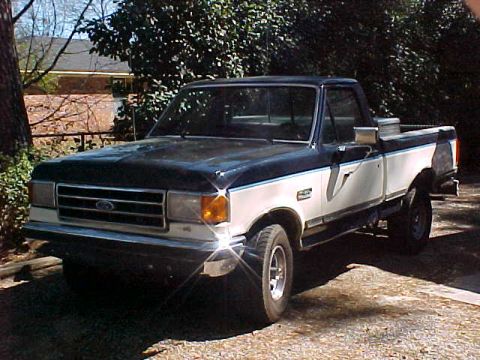 1989 Ford F-150 - This 1987 Ford F-150 pickup truck is shown from a front three-quarter angle.