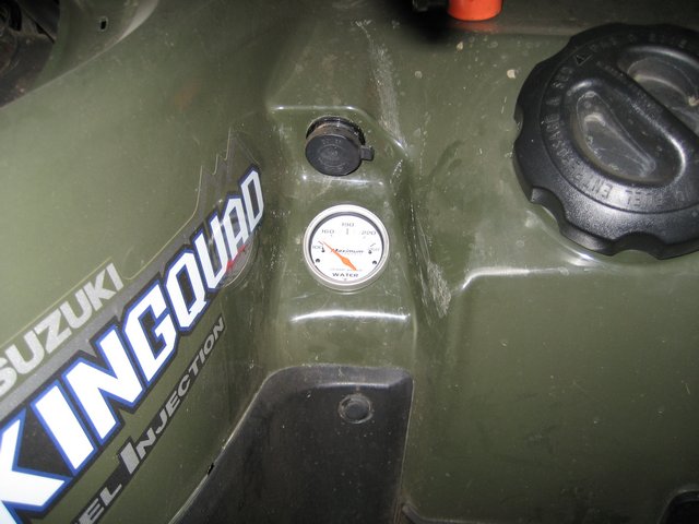 Suzuki King Quad temperature gauge with needle pointing to 'WATER'