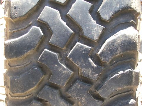 1996 Ford Bronco - Aggressive tread pattern on a tire, likely for off-road use.