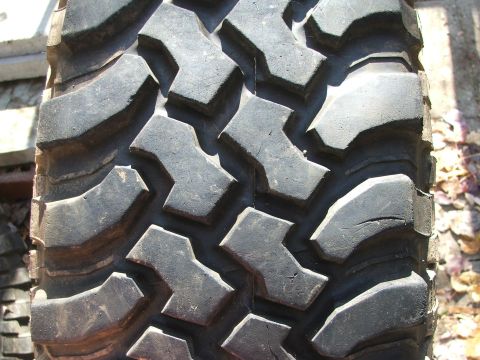 1996 Ford Bronco - Aggressive tread pattern on an off-road tire, likely for a truck or SUV.