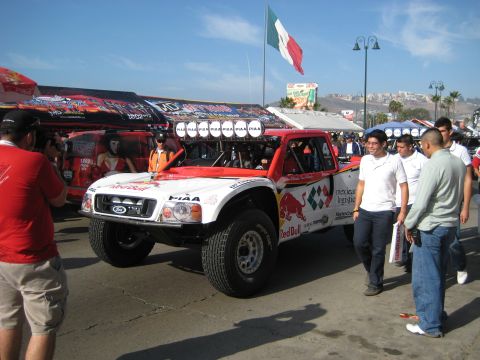 1996 Ford Bronco - This off-road race truck, adorned with Red Bull branding, is seen with a Mexican flag flying in the background.