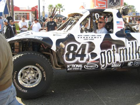 1996 Ford Bronco - This off-road race truck features a distinctive cow print design and 'got milk' branding.