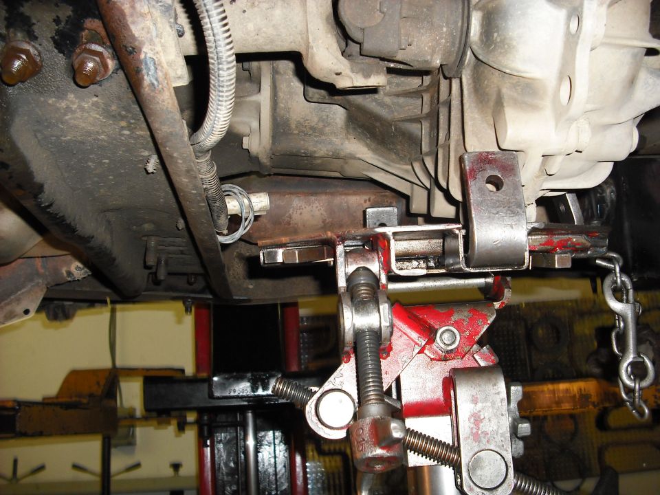 after unbolting the trans mount from the cross member jack up the t-case to remove the transmount and crossmember