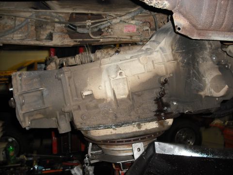 1988 Ford Bronco - slowly bring down the trans not to catch it on something