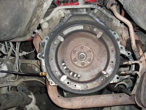 1988 Ford Bronco - the flexplate and dust sheild get removed for the new manual trans ones, but first an oil pan swap and rear main seal