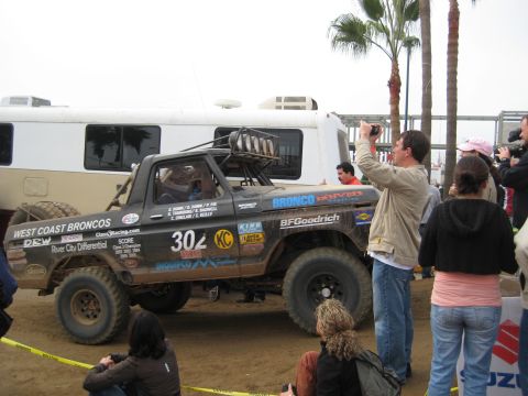 1996 Ford Bronco - This modified Ford Bronco race truck displays numerous sponsor decals and the number 302.