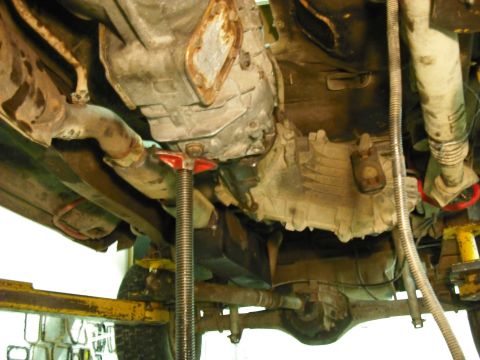 1988 Ford Bronco - clean the mating surface of the trans and t-case and either permeatex or use a gasket to seal it, then bolt it up