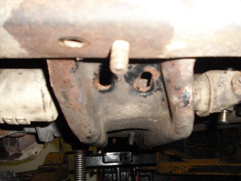 1988 Ford Bronco - to make up for the extra length the crossmember goes back into the existing holes behind where it was, the new support brackets go into the…