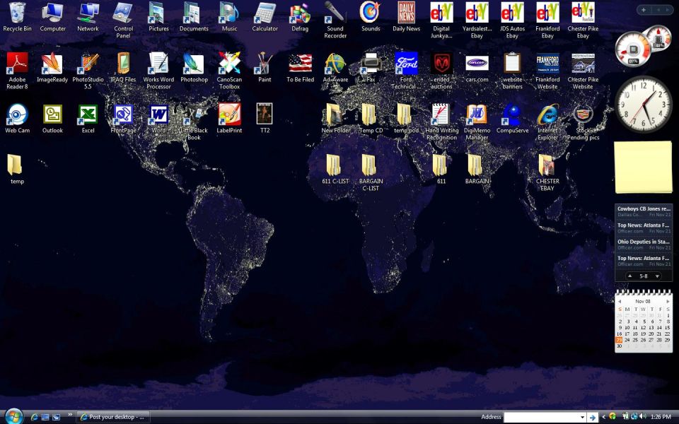 Desktop background of a world map at night with various application icons and a clock