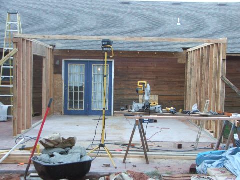 2005 Ford Mustang - House construction in progress with framing, tools, and building materials visible.
