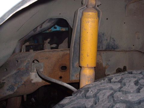 1983 Ford Bronco - Rear axle and shock absorber assembly of a vehicle.