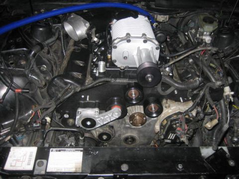 1996 Ford Thunderbird - Engine bay features a supercharger and various engine components, with some visible labels.