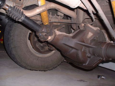 1983 Ford Bronco - Close-up view of a vehicle's rear axle and driveshaft components.